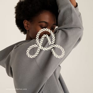 Person in gray hoodie, abstract design